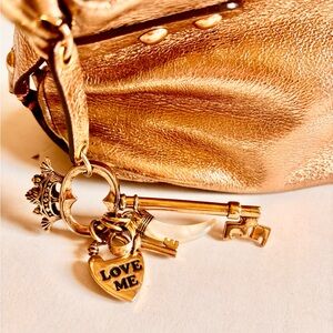 Juicy Couture Metallic Baguette Bag
Roll into 2026 like
The Spring IT bag
Charms